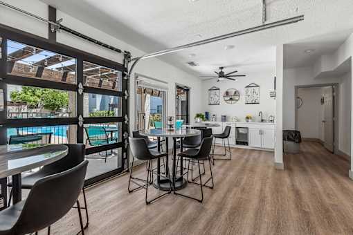 A dining area with a table and chairs is shown.