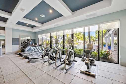 A gym with treadmills and exercise bikes.