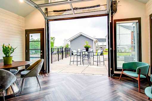 A patio with a table and chairs is shown.