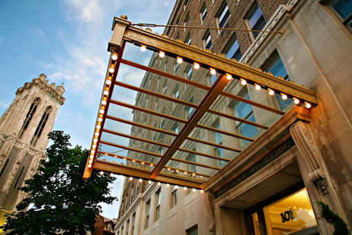 A building with a glass roof and a sign that says 101.