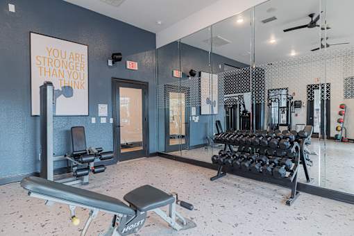 A gym with a sign that says "You are stronger than you think".