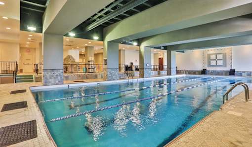 Swimmers in a large indoor pool.