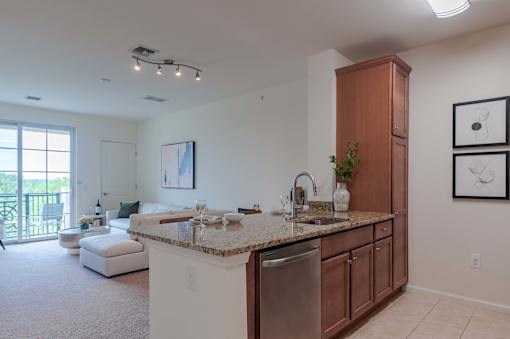 A kitchen with a sink and a counter.