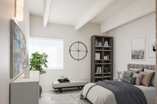 a bedroom with a bed and a clock on the wall