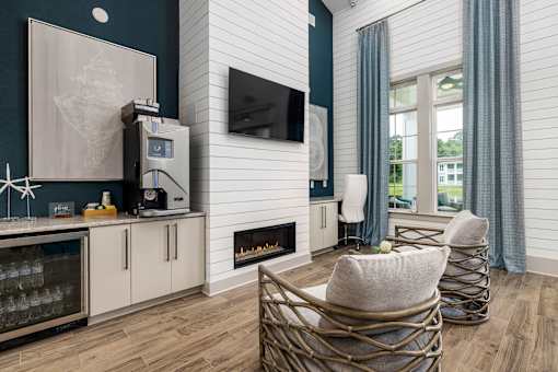 A modern living room with a fireplace and a TV mounted on the wall.