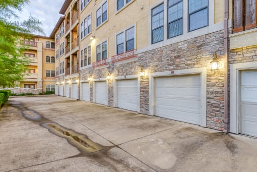a row of garage doors on the side of a building