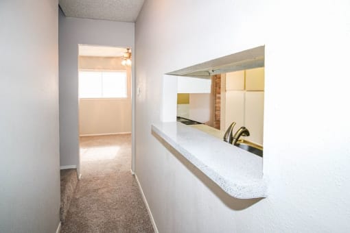 a bathroom with a sink and a mirror on the wall