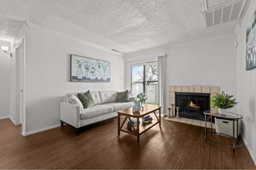 A living room with a fireplace and a couch.
