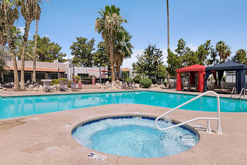 A small round pool with a white ladder.