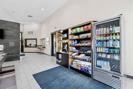 A modern kitchen with a refrigerator and a counter.