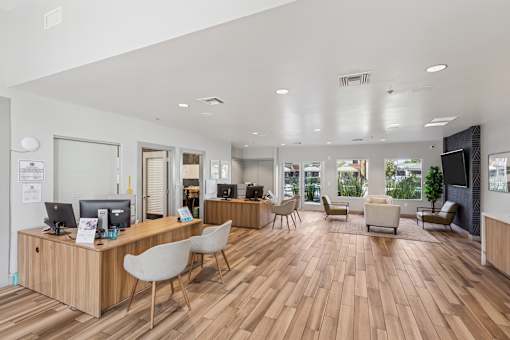 A reception area with a desk and chairs.