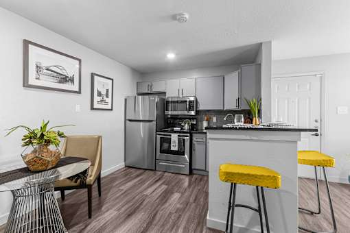 our apartments offer a kitchen and living room with stainless steel appliances