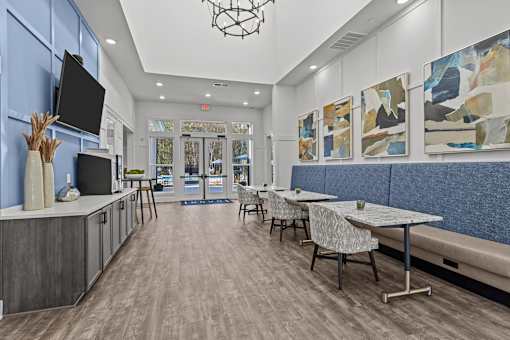 A modern dining area with a long table and chairs.