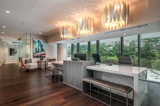 A reception area with a desk and chairs.