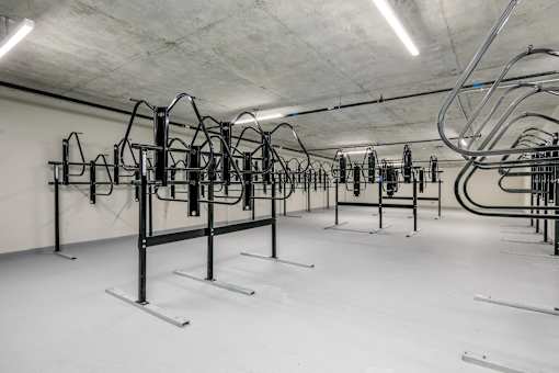 A gym with a row of exercise bikes.