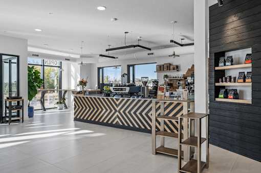 A modern store interior with a black and white striped counter.