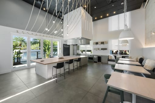 the kitchen and dining area of a modern house with white walls and ceilings