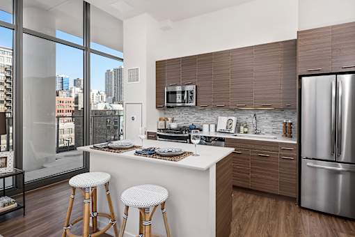A modern kitchen with a view of the city.