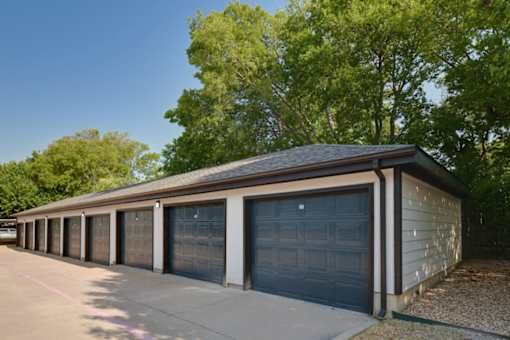 A long building with a row of garage doors.