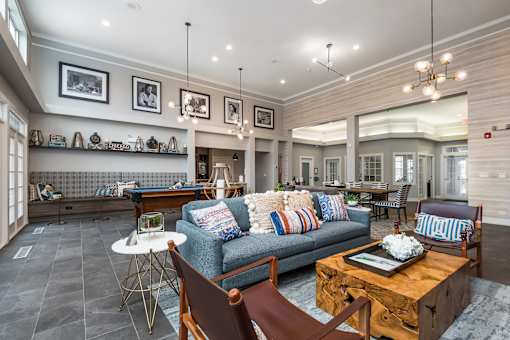 A living room with a blue couch and a coffee table.