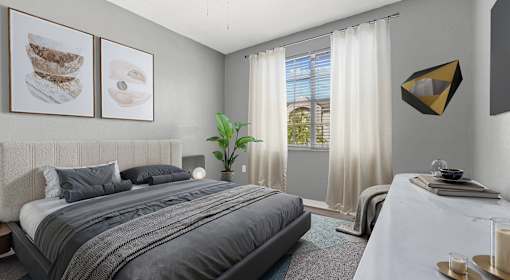 A bedroom with a large bed and a painting on the wall.