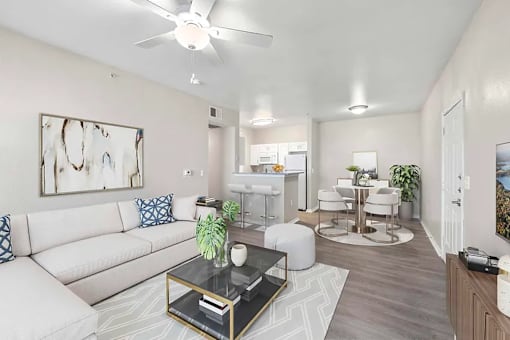 A living room with a white couch and a coffee table.