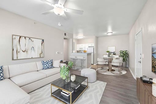 A living room with a white couch and a coffee table.