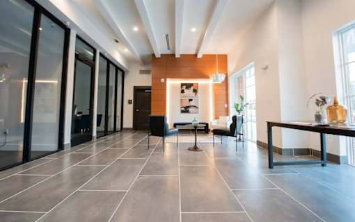 A modern living room with a black and white color scheme.