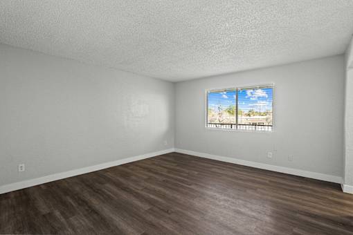 A room with a window showing a view of the outdoors.