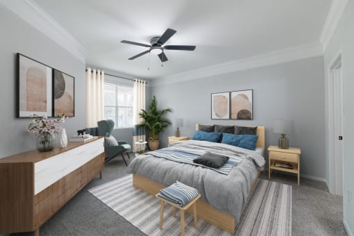 a bedroom with a large bed and a ceiling fan