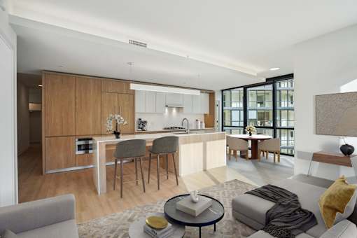 A modern kitchen with a dining table and chairs.