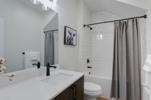 bathroom with shower and tub at Hermosa Village, Leander