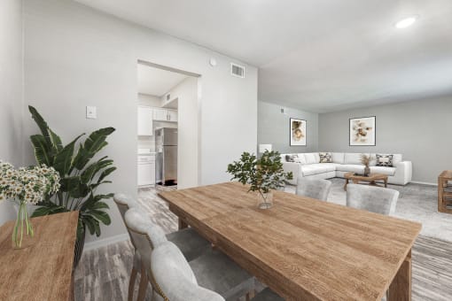 a living room and dining room with a wooden table