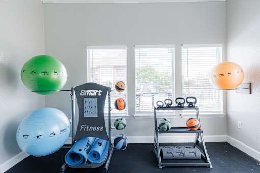 A room with a Smart Fitness equipment set up.