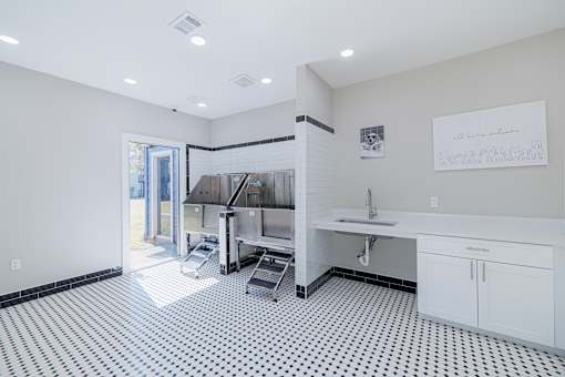 A kitchen with a black and white checkered floor.