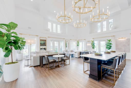 a dining room with white walls and a large table and chairs