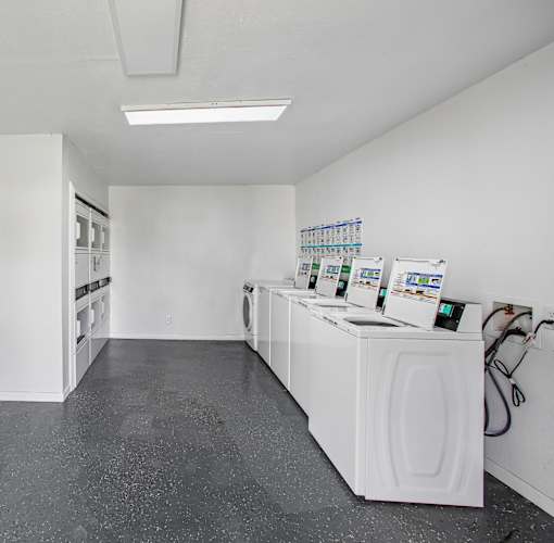 A laundromat with washers and dryers.