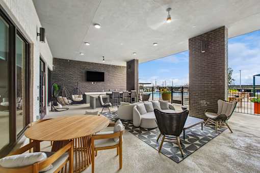 A modern living room with a wooden table and chairs.