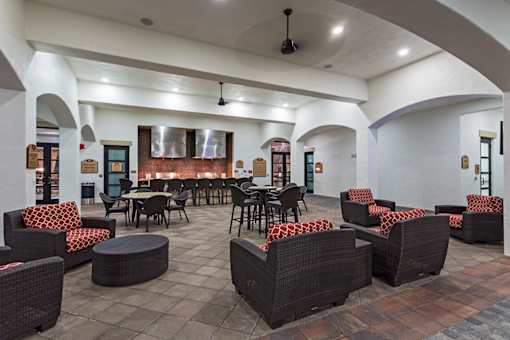 A large room with tables and chairs.