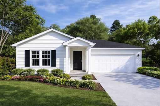 A white house with a black roof and a black garage door.