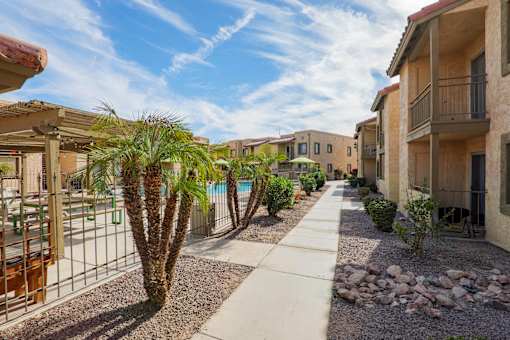 A sunny day at a residential area with a clear blue sky.