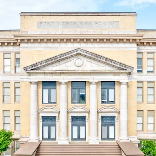 A large building with a sign that says Fort Worth High School.