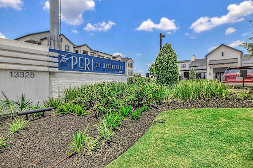 A sign that says "The Peri" is on a wall.