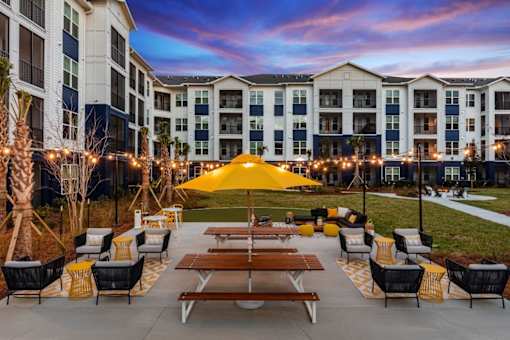 A sunny day at the outdoor seating area of a hotel.