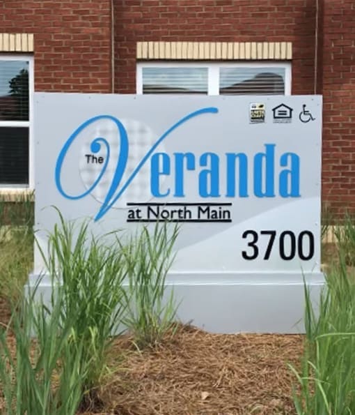 a sign in front of a building that reads the at north main