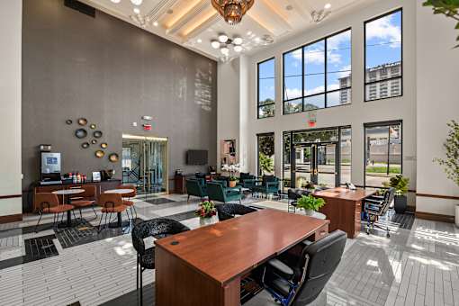 A large conference room with a long table and chairs.