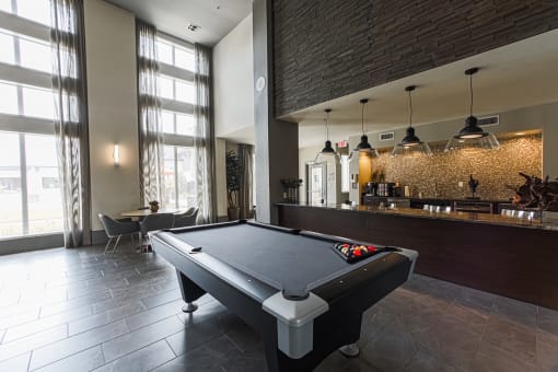 a pool table in the clubhouse