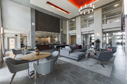 a large lobby with couches chairs and tables