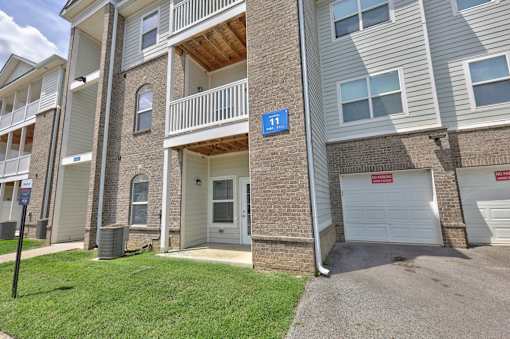 Apartment building with a blue sign that says 11 on it.