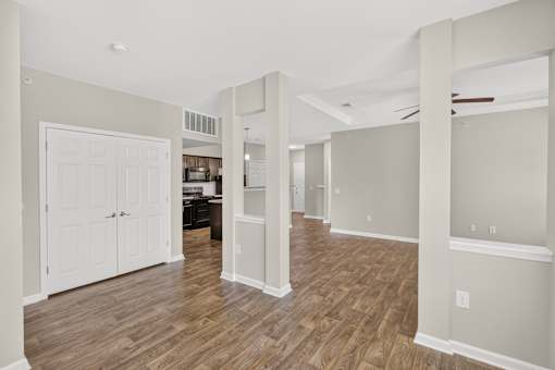 A room with wooden floors and white walls.